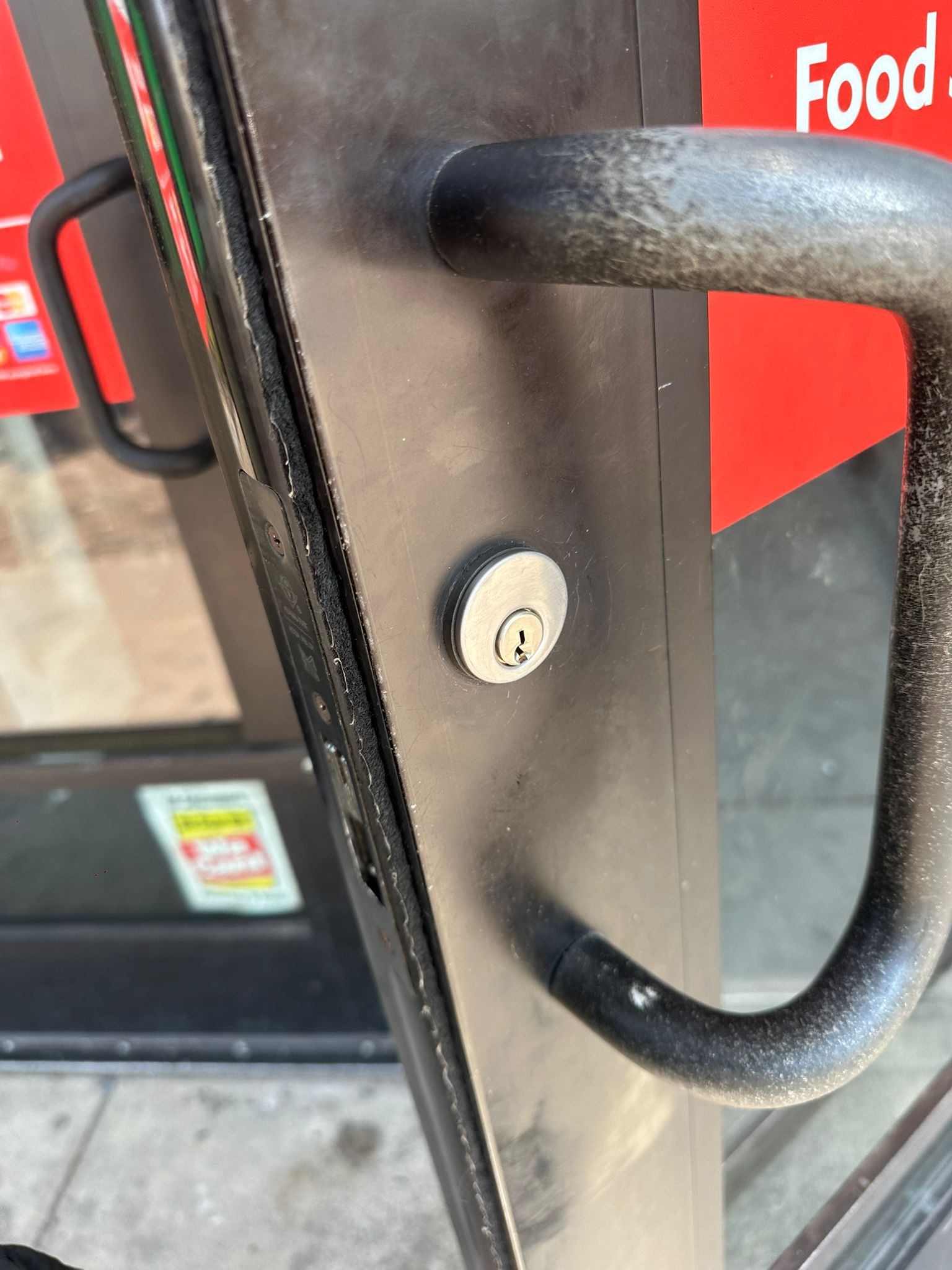 Commercial door hardware installed for a Charleston storefront.